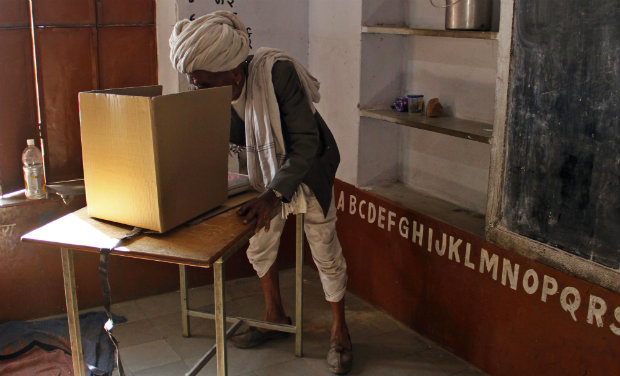 A villager casts his vote at a polling station during Rajasthan state assembly elections at Hokra village near Ajmer. -PTI A villager casts his vote at a polling station during Rajasthan state assembly elections at Hokra village near Ajmer. -PTI